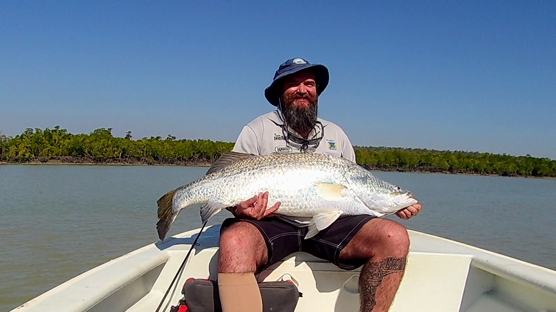 Fisherman with a great Barramundi catch in a Tender boat Northern Territory