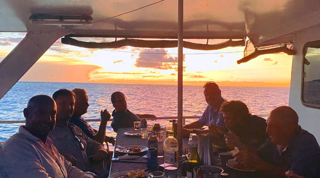 dining onboard Iron Lady top deck as the sunsets